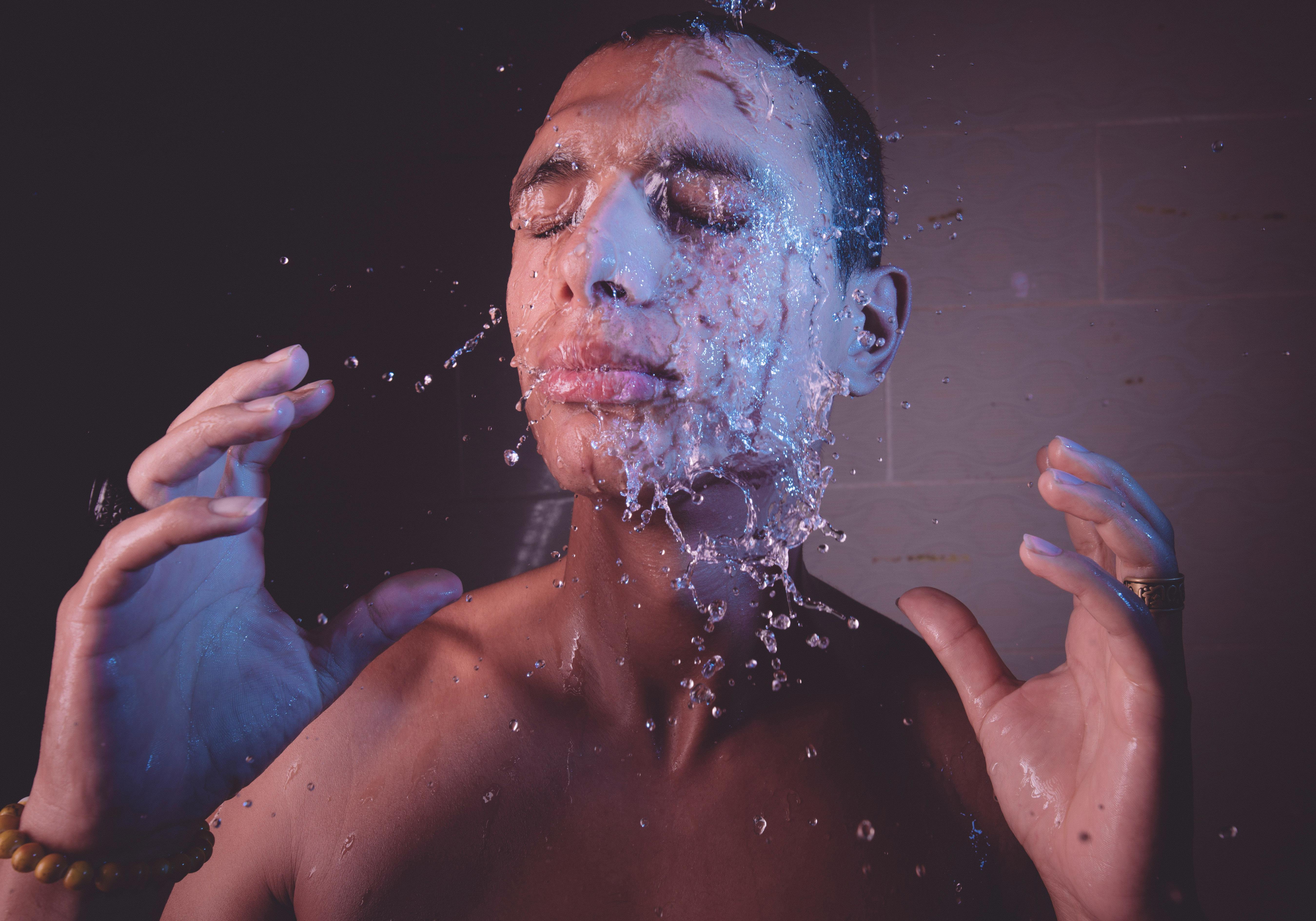 Human Hand Under Pouring Water · Free Stock Photo