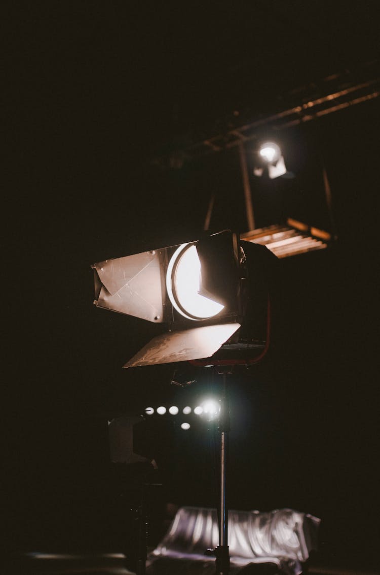 Bright Spotlight Glowing In Dark Room