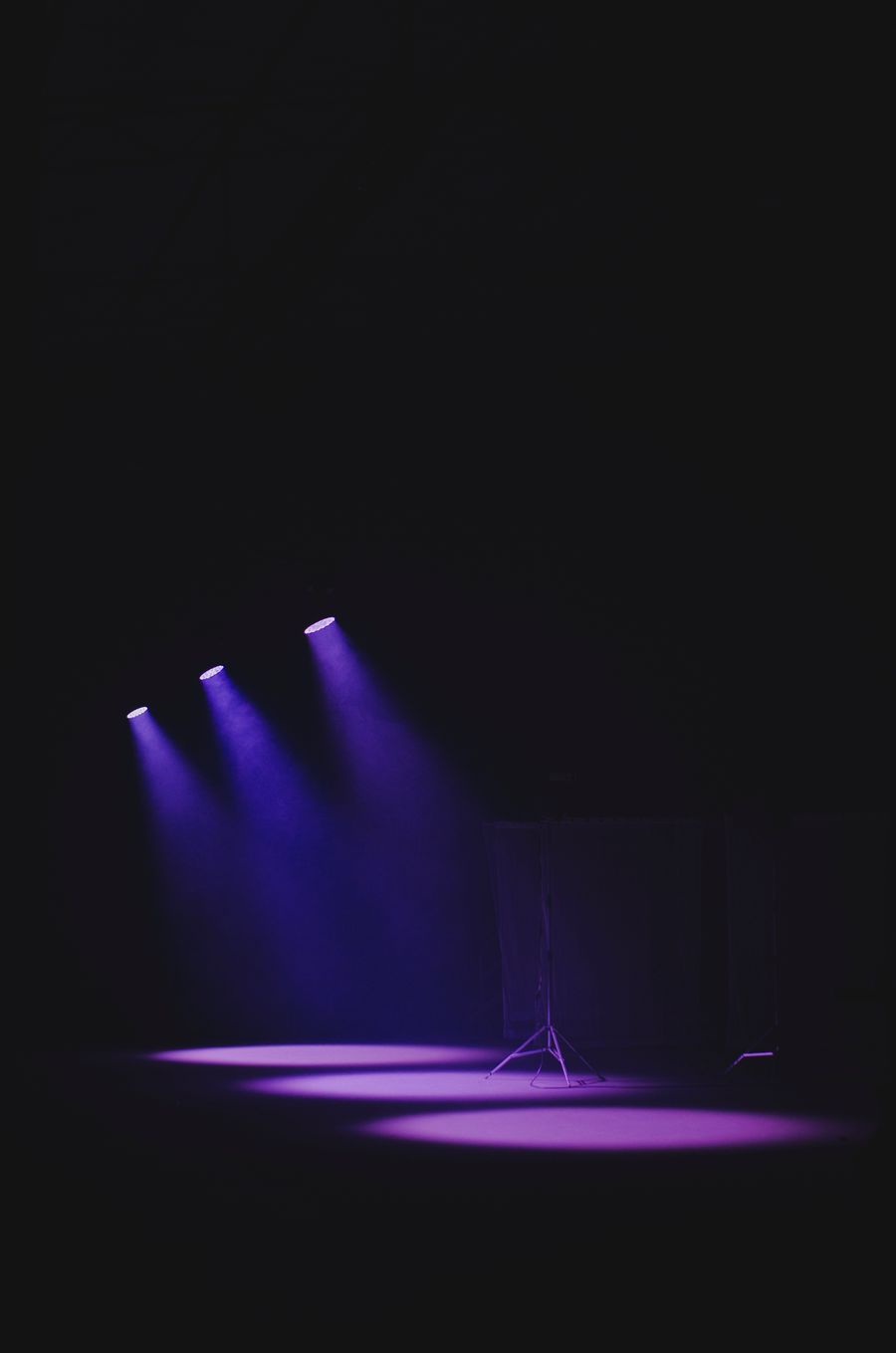 Coloured wash luminaires lighting an empty stage
