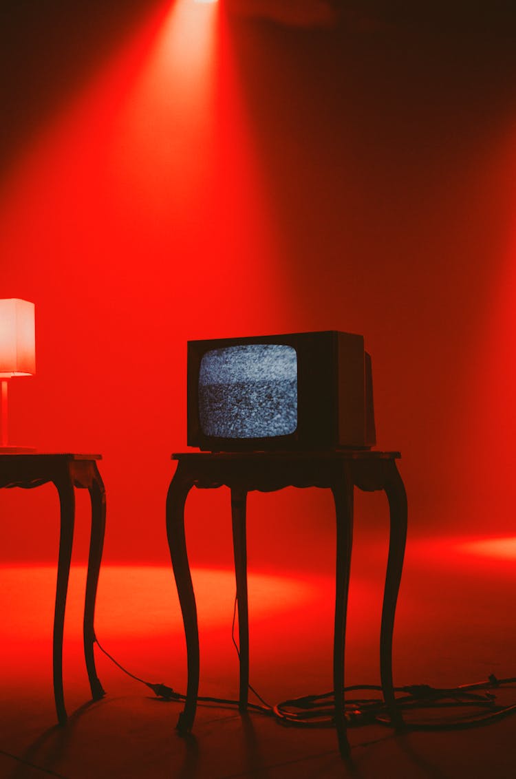 Television On Brown Wooden Table