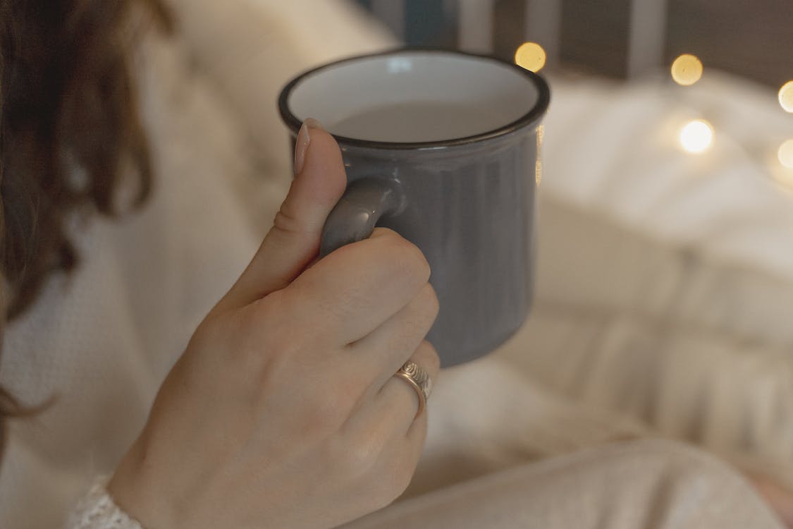 Close-Up View of a Person Holding Mug
