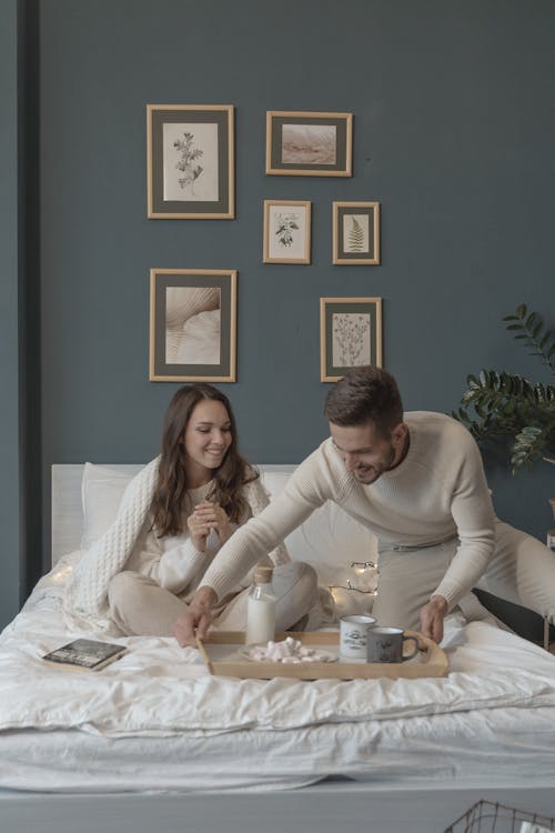 Free A Man Serving Breakfast in Bed Stock Photo