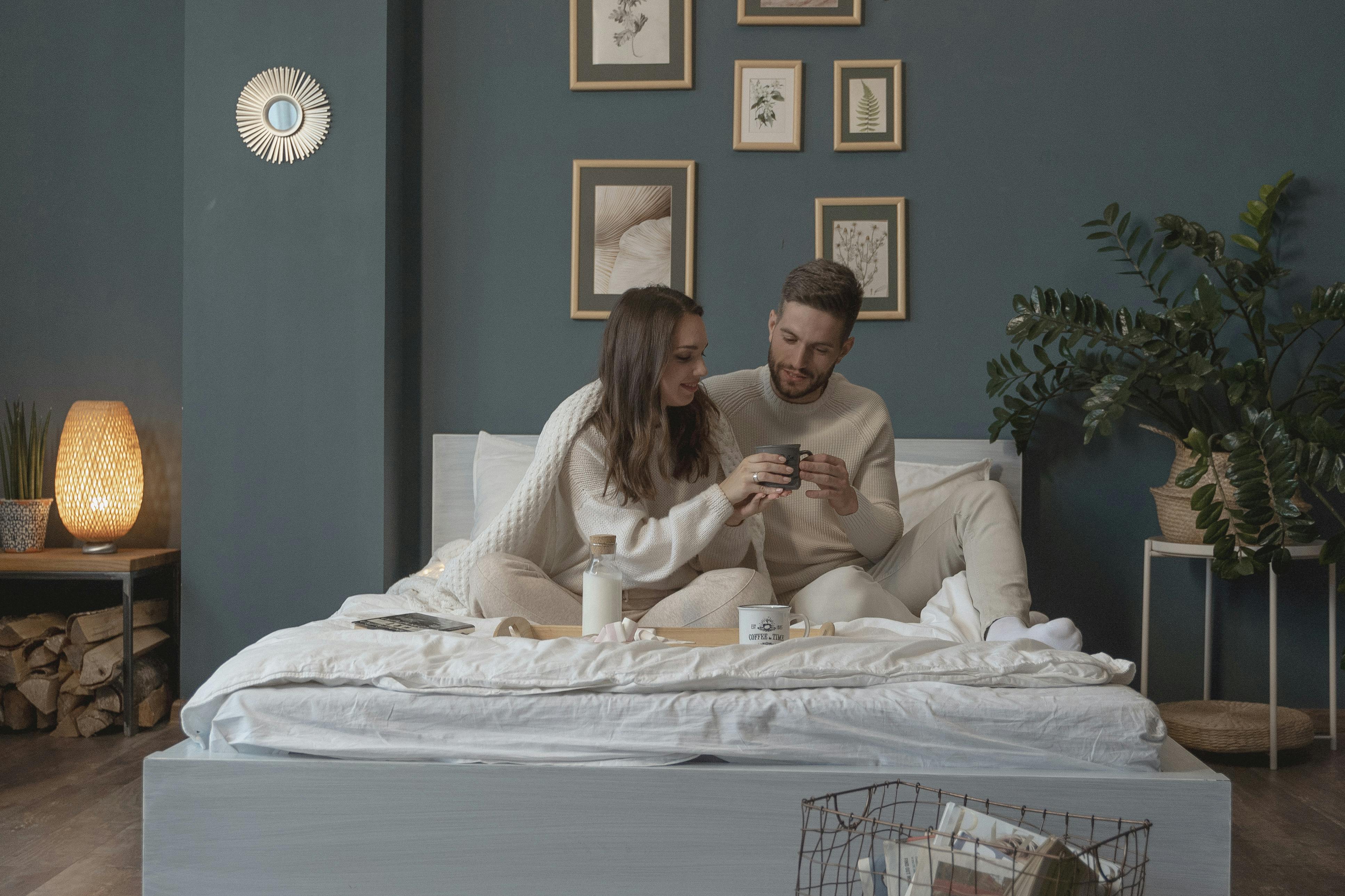 couple eating breakfast in bed