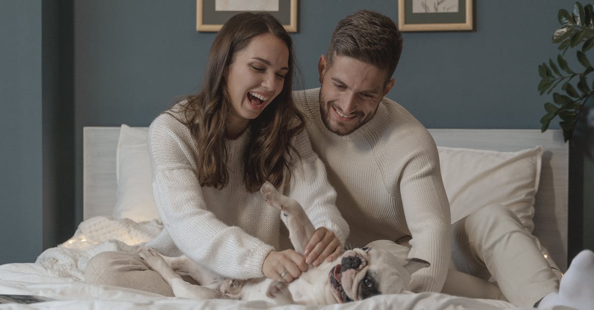 A Couple Cuddling Their Cute Dog