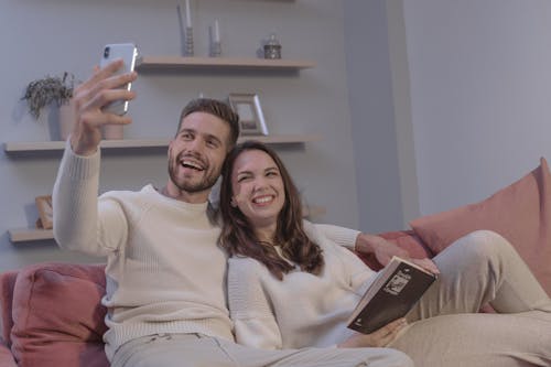Free A Happy Couple Taking a Selfie Stock Photo