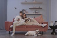 A Man and a Woman Sitting on a Couch