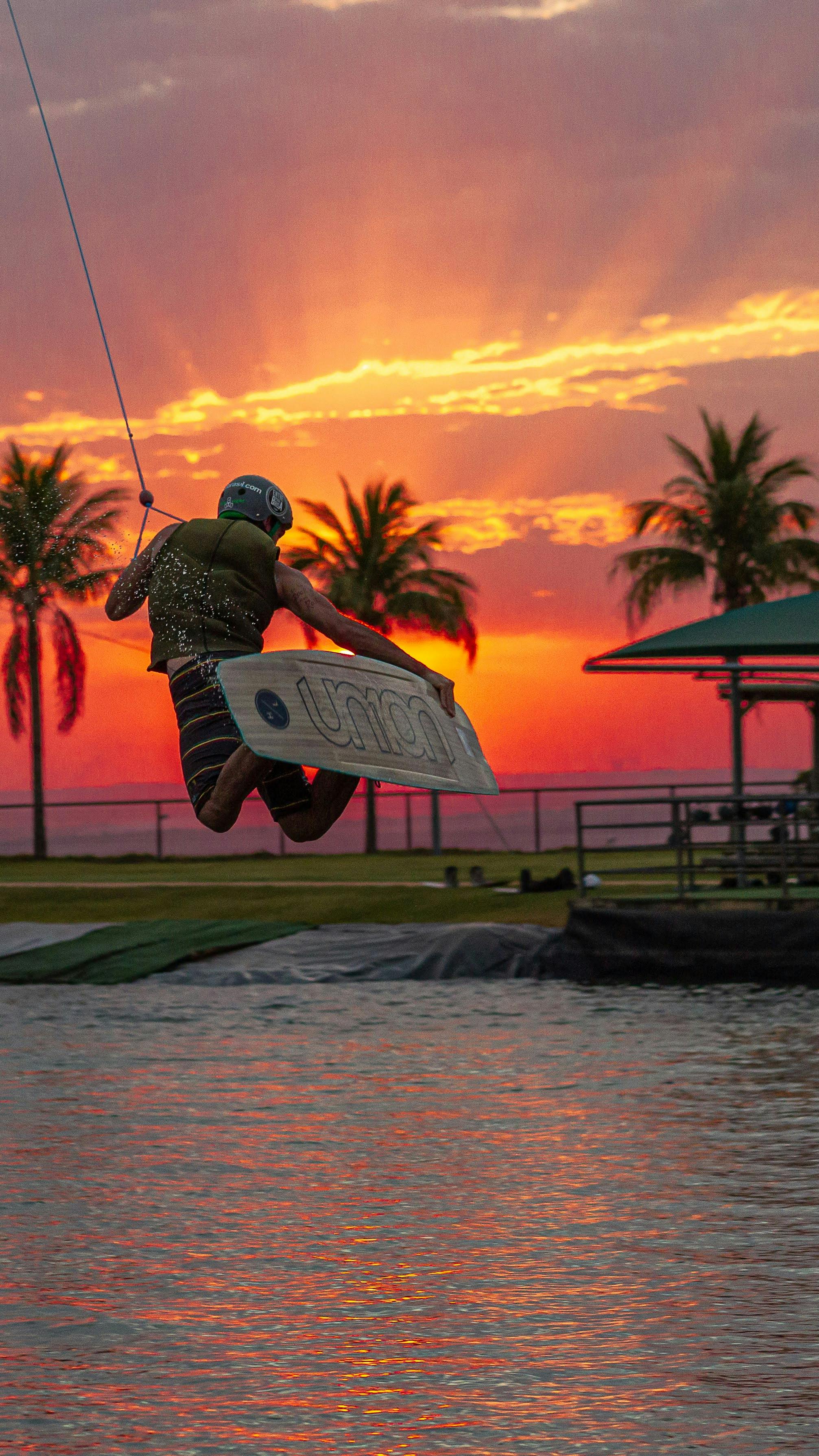 Water Boarding During Sunset · Free Stock Photo