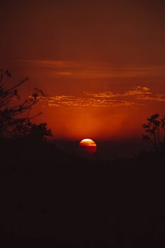 Captivating orange sunset with silhouette in Rosário Oeste, Brazil.