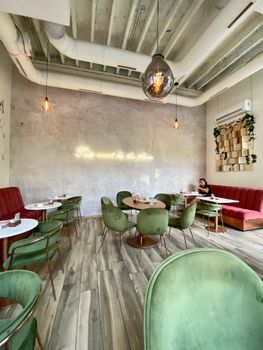 Stylish modern cafe in Belgrade featuring chic decor and dining setup. Ideal for eating out. - Fotografer Sidoarjo