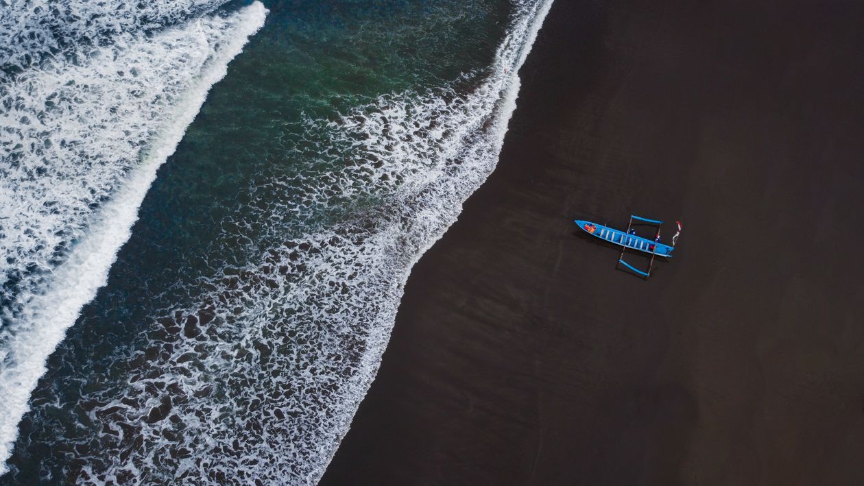 Aerial View of Blue Boat on Seashore · Free Stock Photo