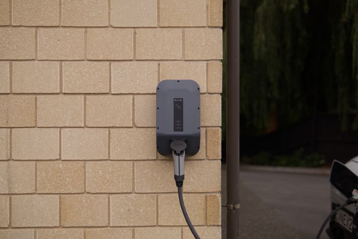 Wall-mounted electric vehicle charger, photo by Ed Harvey on Pexels