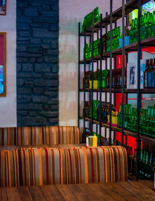 Free Bar Wall Decoration from Empty Bottles on Shelves  Stock Photo