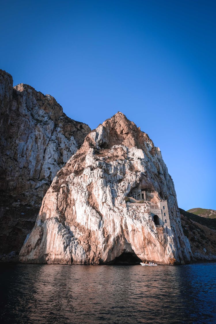 Rough Rocky Crag On Sea Coastline