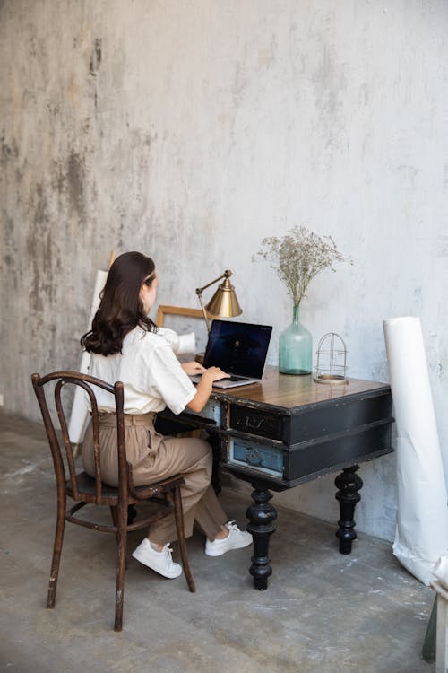 Woman Using Laptop at Home 