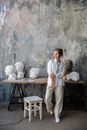 Sculptor Posing in a Studio