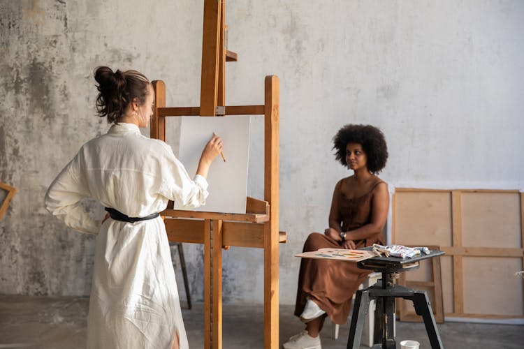 Painter Painting A Woman 