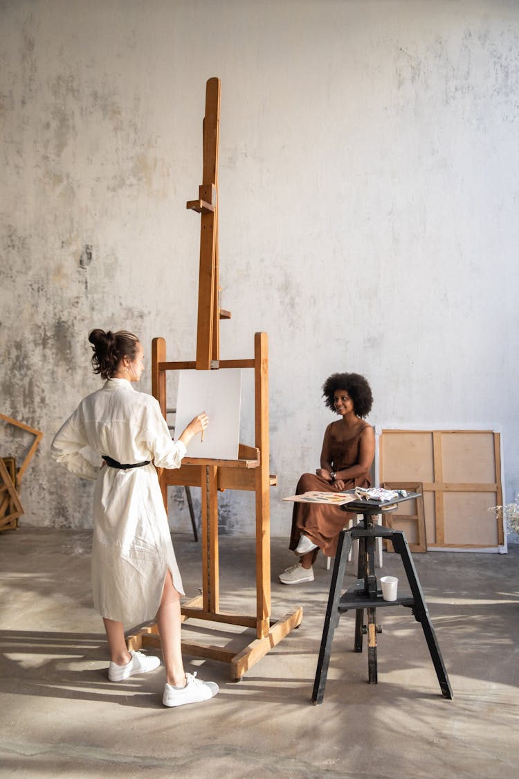 Painter Painting A Woman 