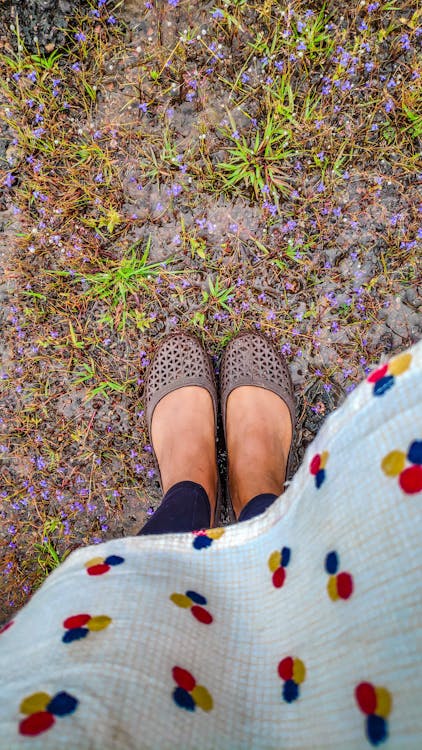 High-Angle Shot of a Person in Wearing Flats