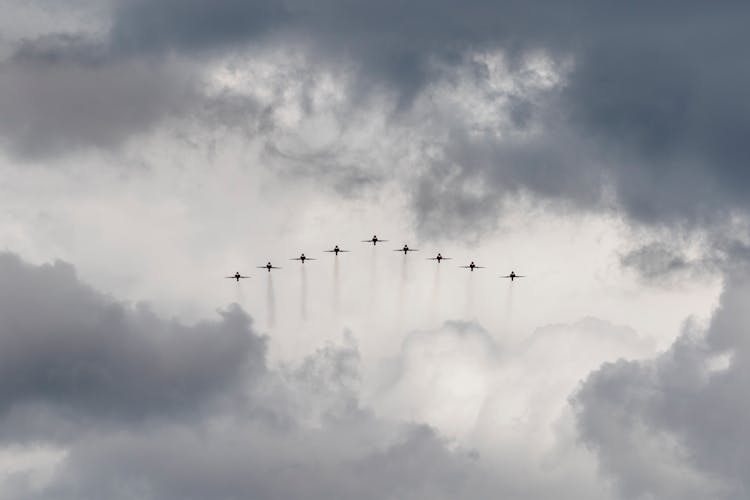 Fighter Jets Flying Under White Clouds