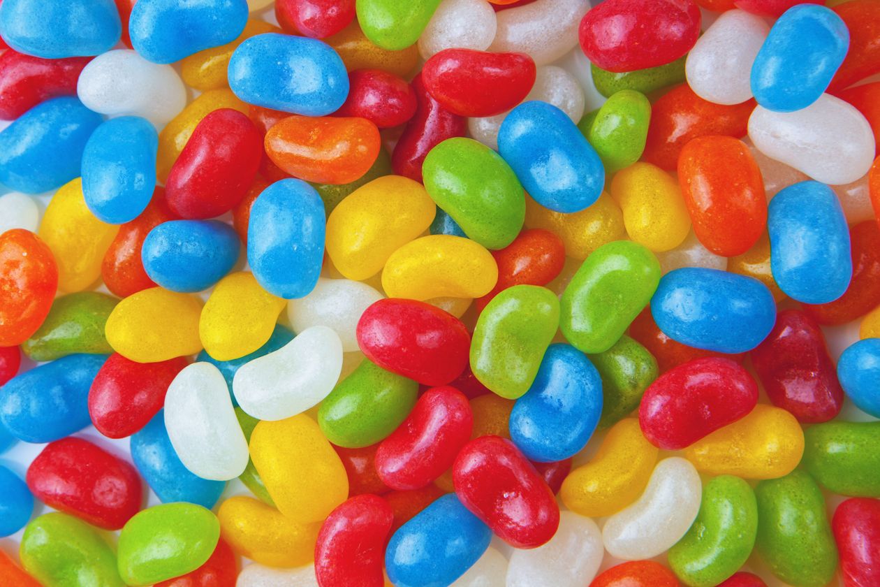 Close-up of assorted colorful jelly beans representing choosing the right mix of referral rewards