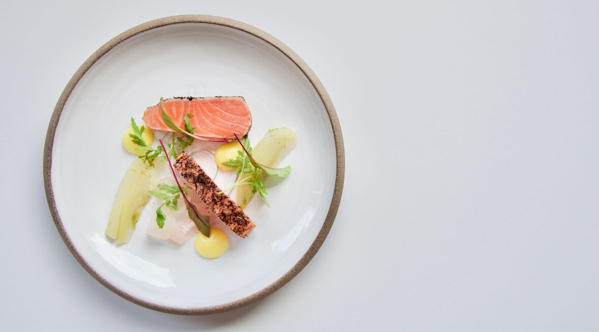A plated New Nordic salmon dish, Helsinki fine dining, Finland