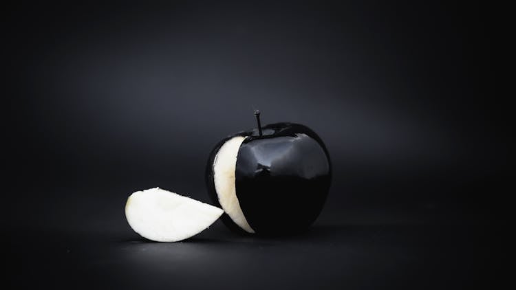 Black Apple With Slice Cut Out