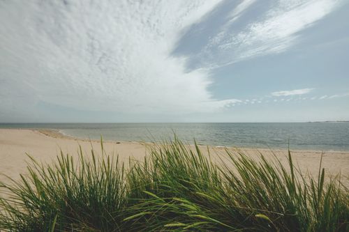 Free Peaceful beach at Sylt, Germany with clear sky and calm ocean waves. Stock Photo