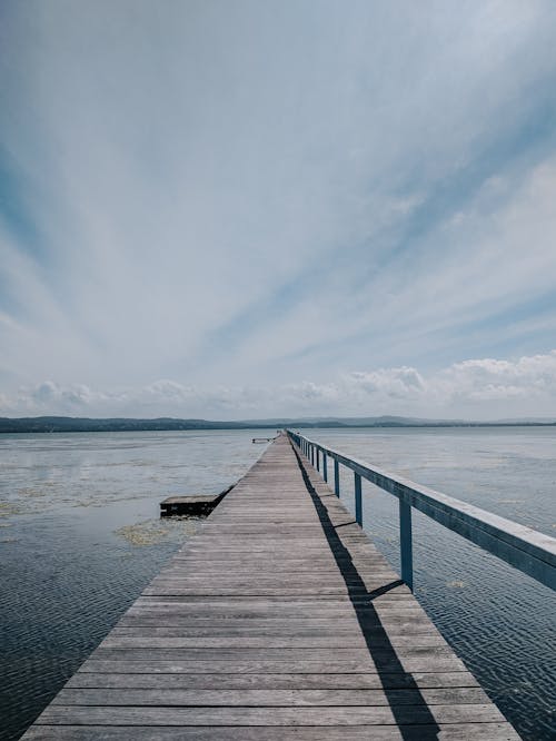 Brown Wooden Dock on Body of Water 