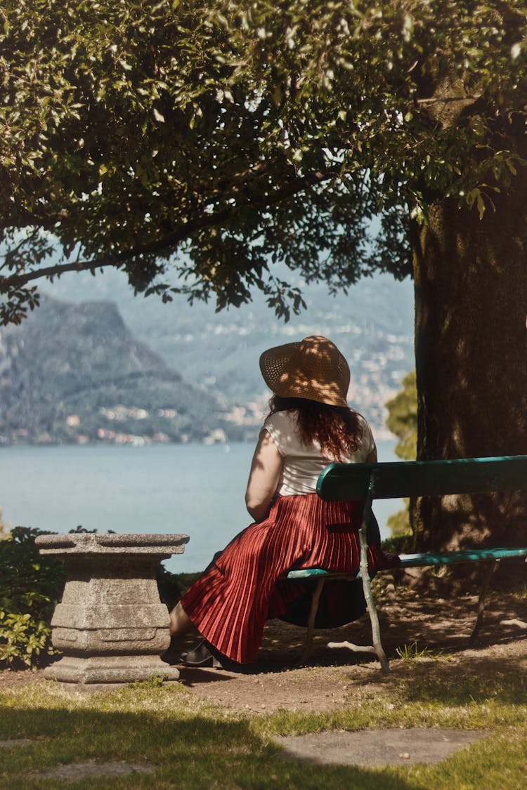 Woman On Bench With View On Lake