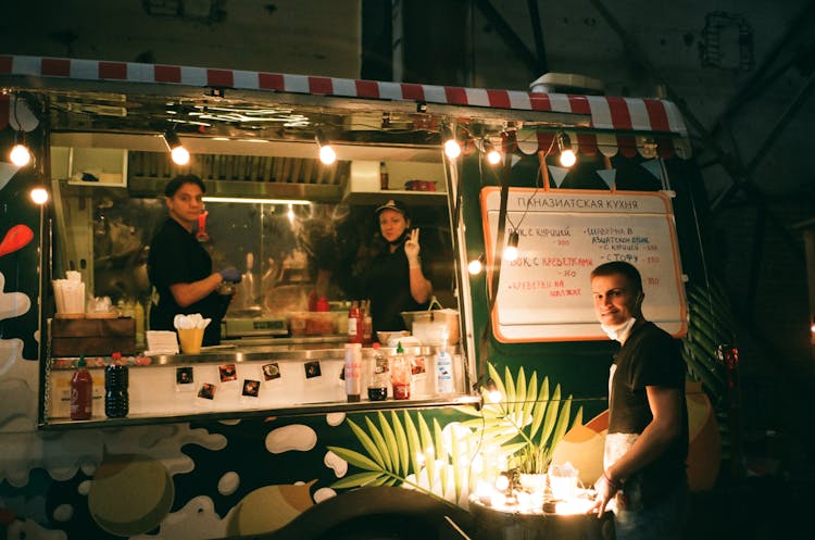 People Working In Street Food Truck