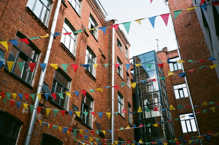 Facade Of Residential Building With Decorative Flags