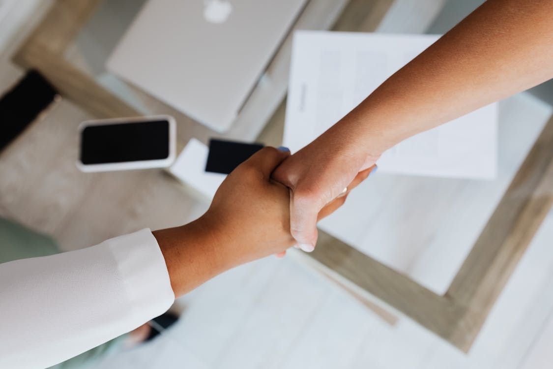 Free Two People Doing A Handshake Stock Photo