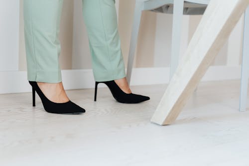 Close-Up View of a Person Wearing Black High Heels