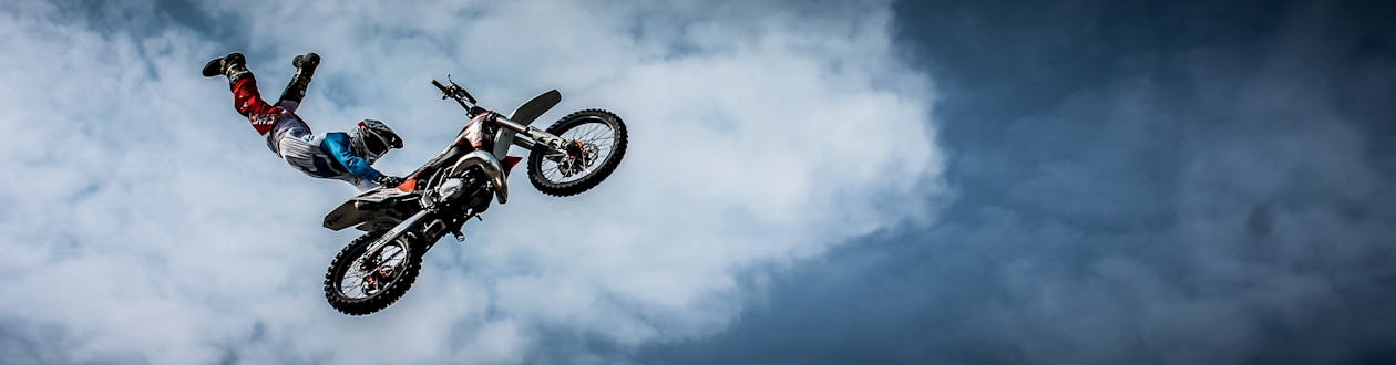 Man With Off Road Motorcycle Doing Tricks