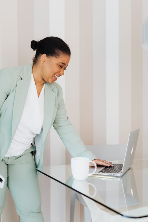 Woman Using Laptop in Office