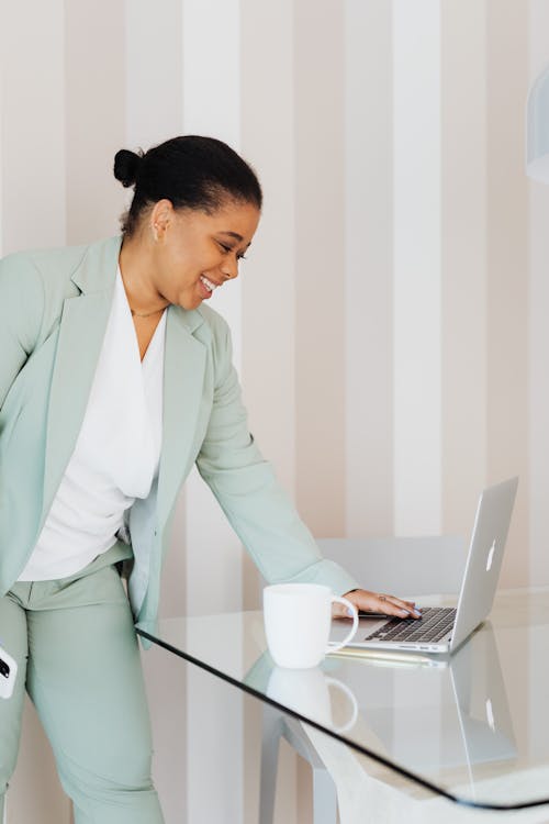 Woman Using Laptop in Office