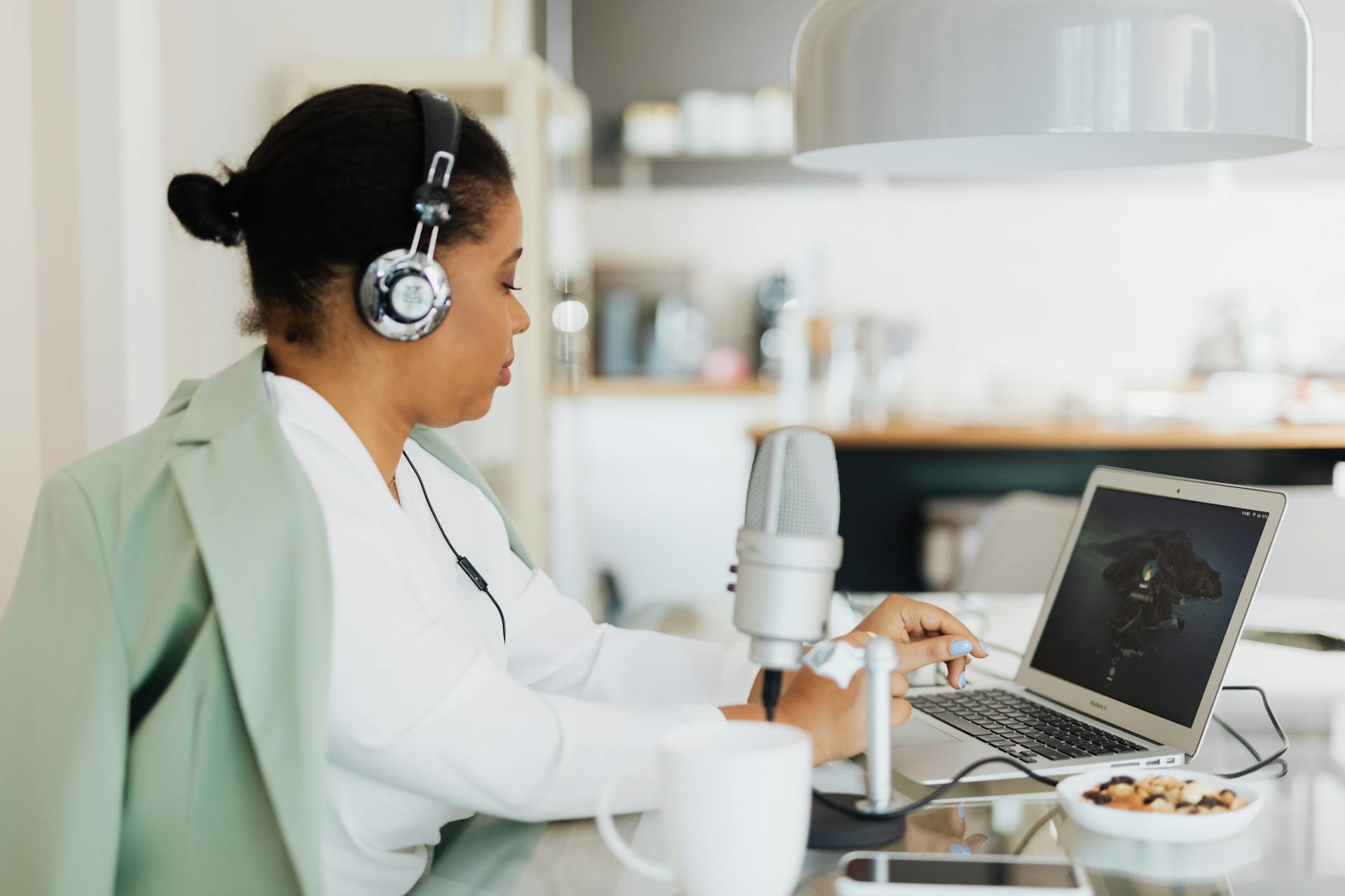 Woman in Headphones Using Laptop