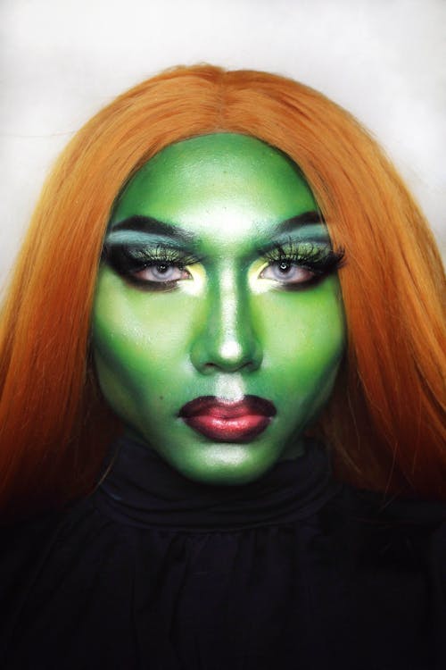 Woman with green paint on face