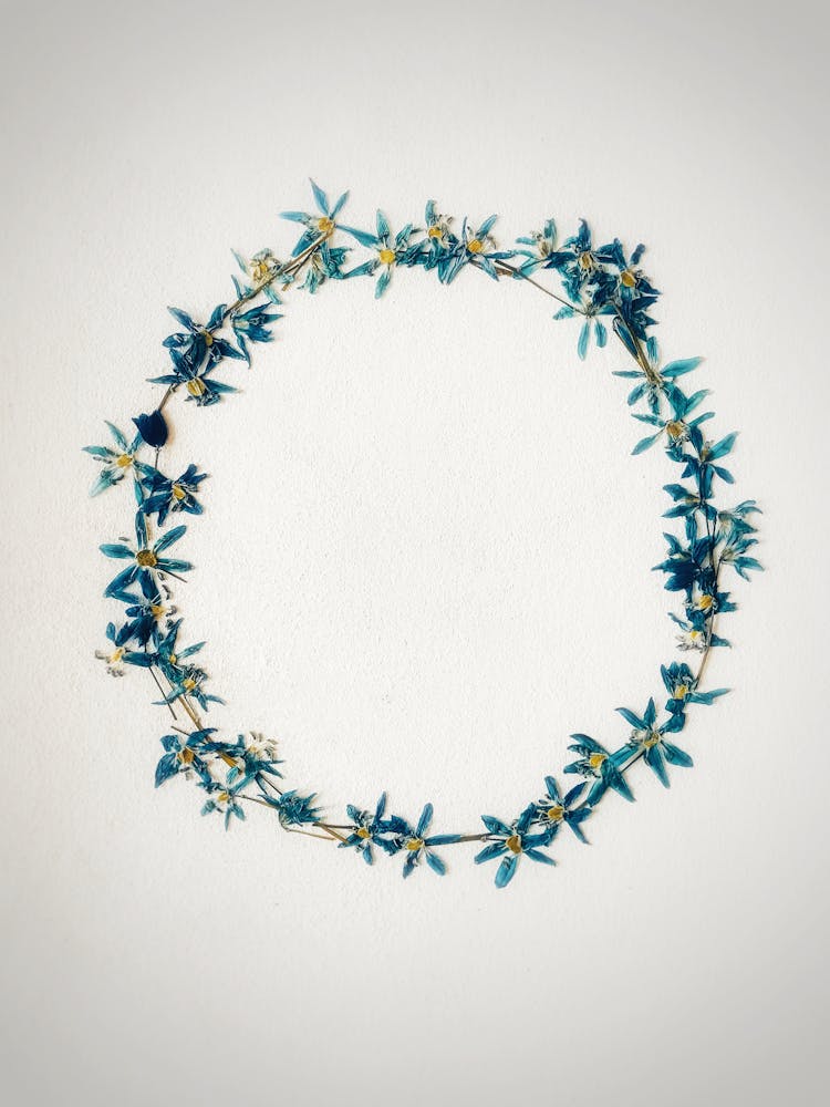 Elegant Wreath With Delicate Flowers Placed In Table