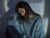 Brunette Woman Wearing Blue Sweater