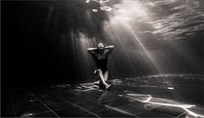 Woman Sitting Underwater