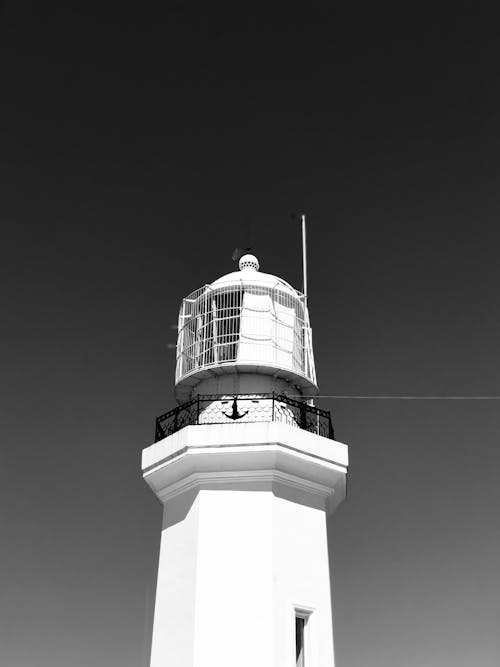 A Grayscale Photo of a Lighthouse