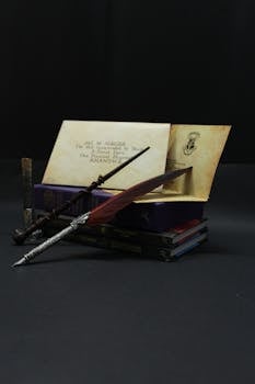 Elegant antique setup with a quill, parchment, and classic books, perfect for themed storytelling.