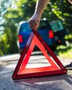 Person Holding Red and Black Frame