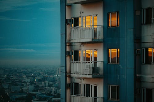 Free Windows Of Apartment Building Reflecting Sunset Stock Photo
