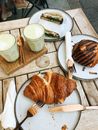 Bread on White Ceramic Plate Beside White Ceramic Mug