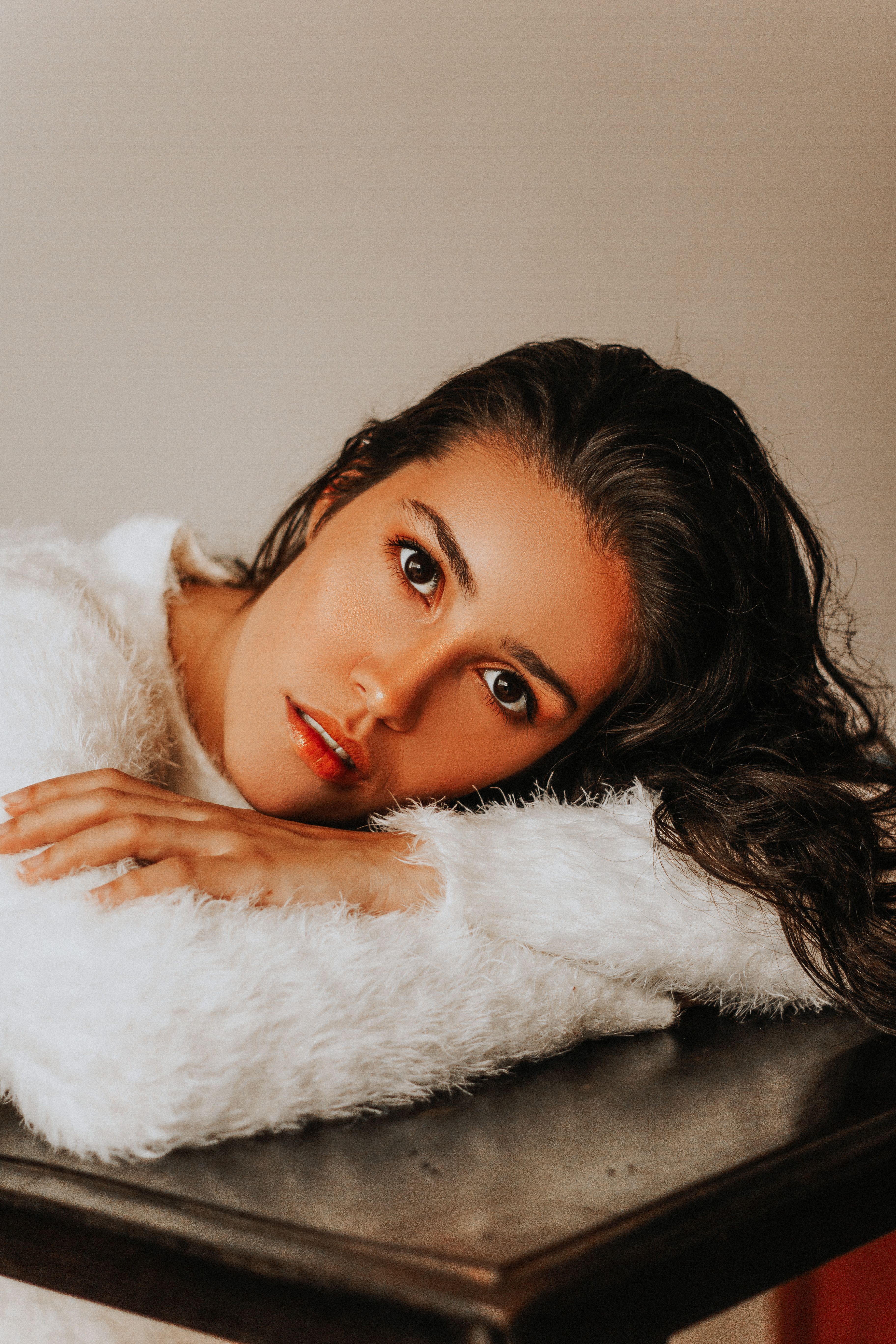 A Beautiful Woman in White Fur Coat · Free Stock Photo