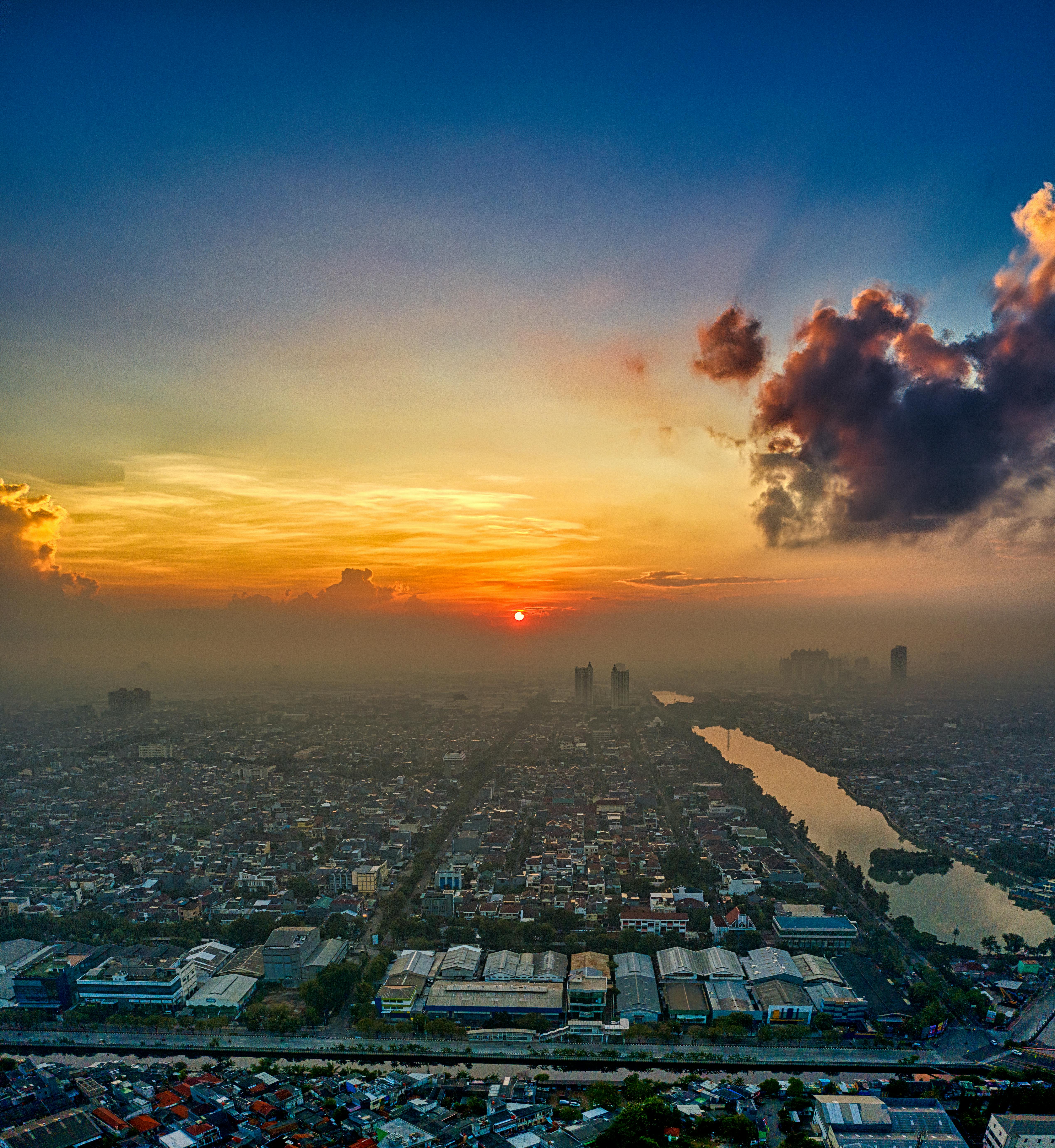 city skyline under blue sky during sunset