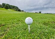 White Golf Ball on Green Grass Field