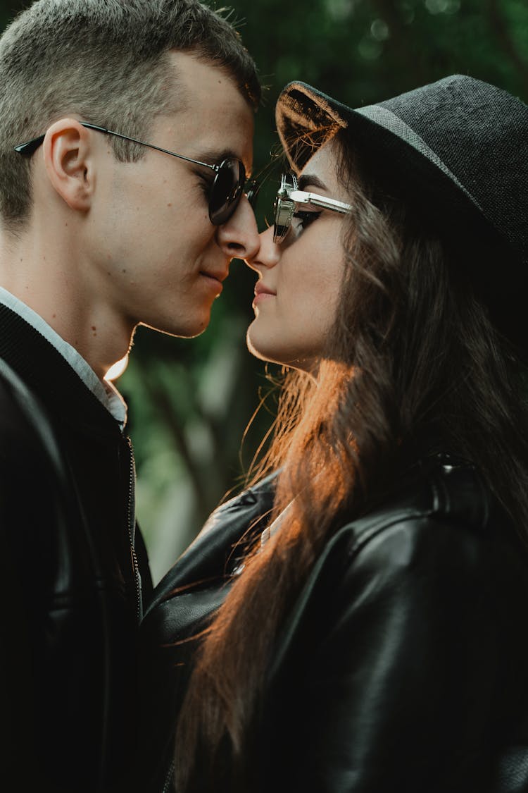 Stylish Couple In Sunglasses Rubbing Noses